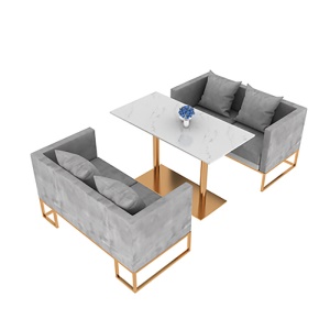 Table à manger en marbre et fauteuil avec support en fer forgé