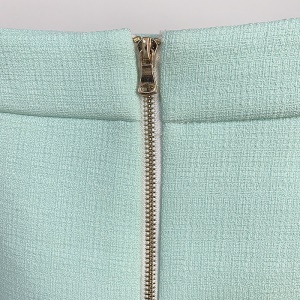 Jupe courte pour femme à double boutonnage en fibre de polyester avec boucle en métal