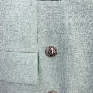 Jupe courte pour femme à double boutonnage en fibre de polyester avec boucle en métal