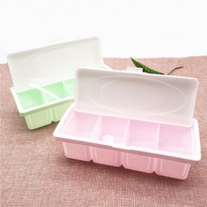 Boîte  plastique à quatre compartiments pour conserve d'assaisonnements