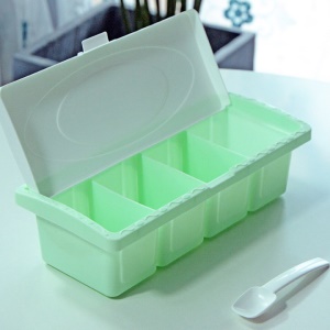 Boîte  plastique à quatre compartiments pour conserve d'assaisonnements