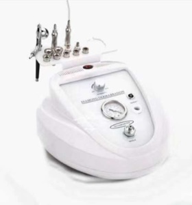 Instrument de dermabrasion à pression négatif et micro sculpteur en diamant