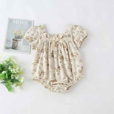 Combinaison bébé en coton et à motif fleuri