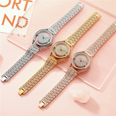 Montre pour femmes à travers le fond incrusté de diamants bande d'acier étanche