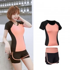 Tenue de sport femme short combiné legging et t-shirt à cou rond