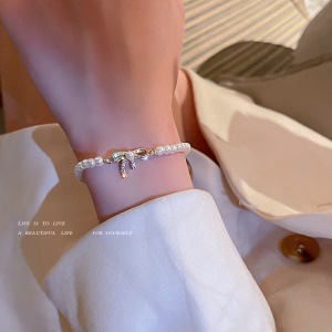 Bracelet de perles, nœud doré incrusté de diamant artificiel