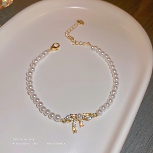 Bracelet de perles, nœud doré incrusté de diamant artificiel
