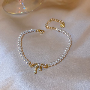 Bracelet de perles, nœud doré incrusté de diamant artificiel