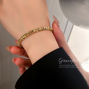 Bracelet doré en alliage de métal