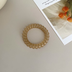 Attache  cheveux  en forme de spirale en plastique