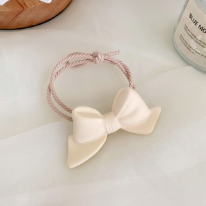 Attache cheveux corde à cheveux avec décoration florale et de noeud papillon