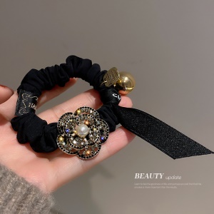 Boucle de cheveux arc perles d'or