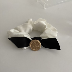 Elastique à cheveux avec décoration de noeud papillon