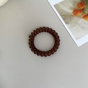 Attache  cheveux  en forme de spirale en plastique