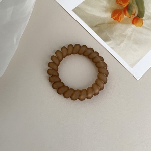 Attache  cheveux  en forme de spirale en plastique